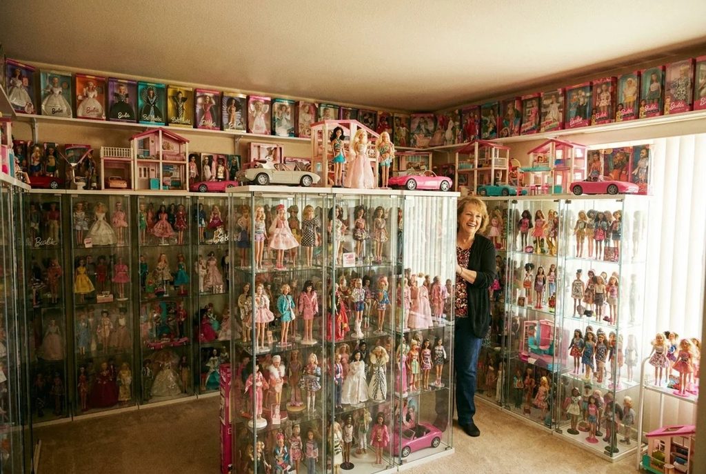 Barbie Collector with a large collection of dolls.