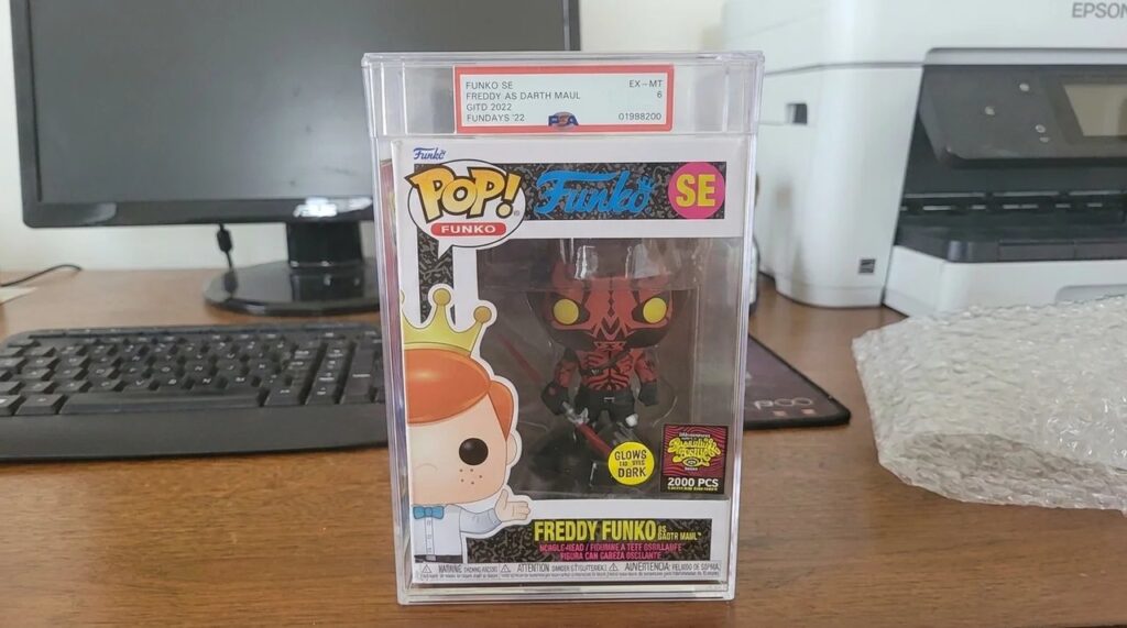 Graded Funko Pop on Desk