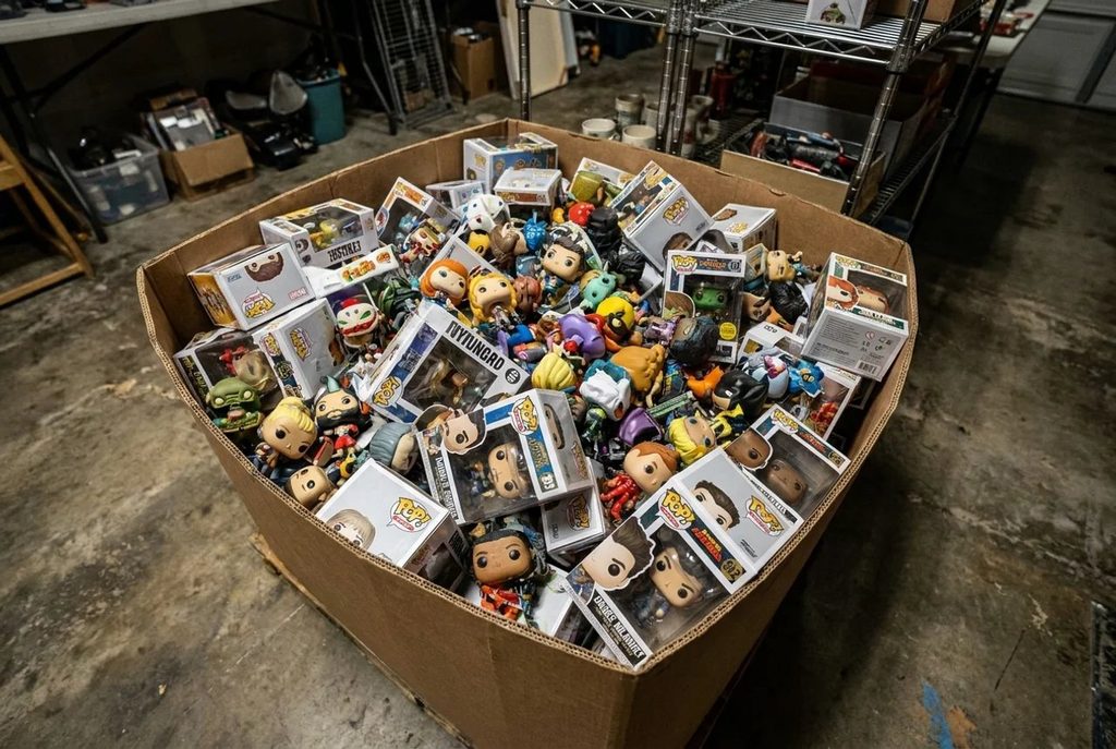Large collection of Funko Pops in a large box collecting dust.