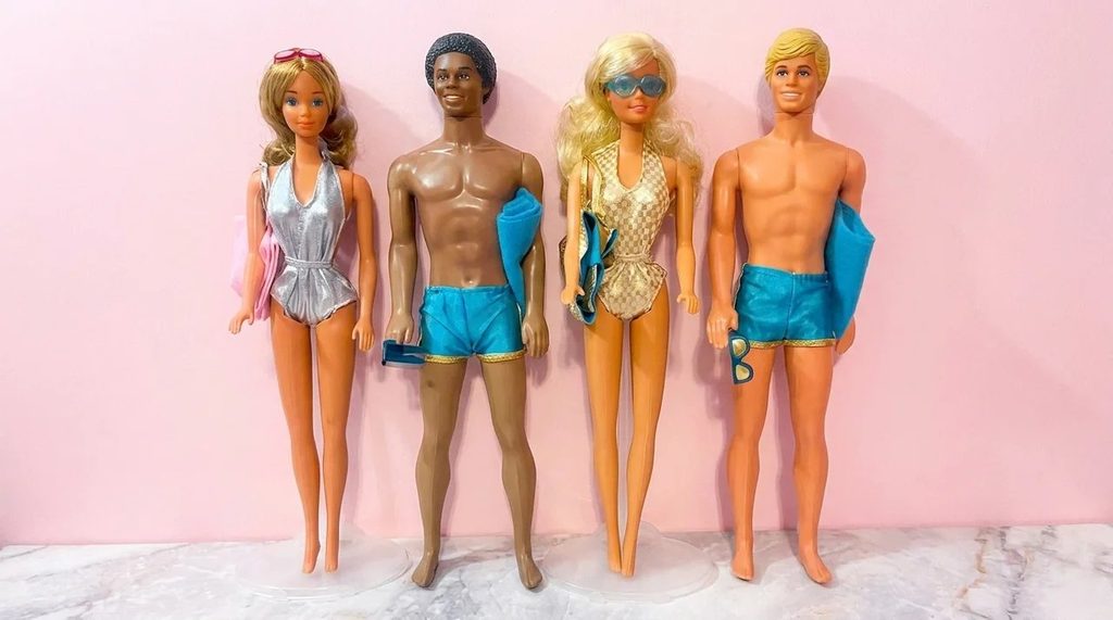 A variety of Barbie Dolls out of their original boxes.