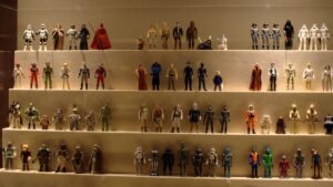 Vintage Kenner Star Wars action figures in a museum-style display case